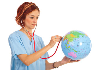 Fototapeta premium Doctor woman examine world globe