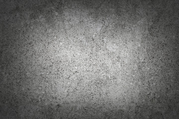 Fototapeta premium Dark gray rough concrete wall background photo background