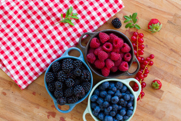 Three bowls of fresh berries