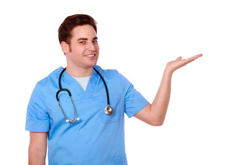 Attractive male nurse holding his left palm