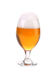 Closeup of beer glass with foam.