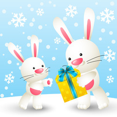 Cute white rabbits with gift