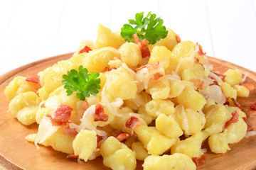 Small potato dumplings with bacon and cabbage