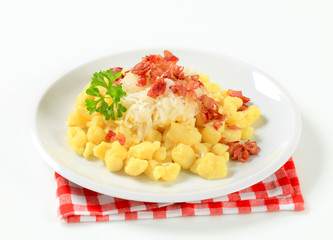 Small potato dumplings with bacon and cabbage