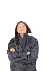 Naklejka na ściany i meble Man in waterproof coat with hood.