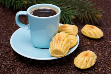 cup of coffee and cookies madeleines, selective focus