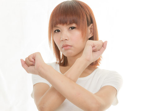 bright picture of young Asian woman making stop gesture