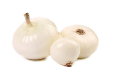 Close up of three white onions.