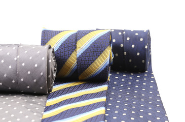 Rolled up three man's ties.