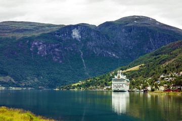 Fototapeta na wymiar Passenger liner in Geiranger sea port, Norway