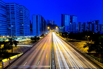 Fototapeta na wymiar Moving cars on highway at night