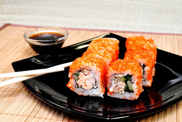 Japanese rolls with masago caviar, cheese and cucumber