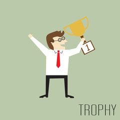 Businessman holding a trophy