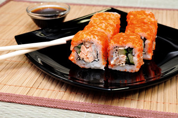 Japanese rolls with masago caviar, cheese and cucumber