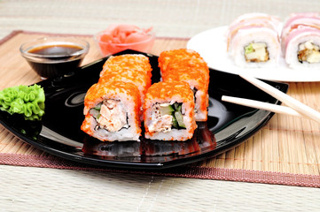 Japanese rolls with masago caviar, cheese and cucumber
