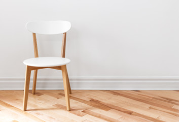 White chair in an empty room - obrazy, fototapety, plakaty