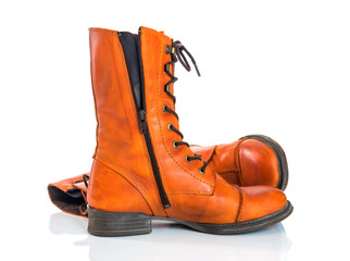 Orange leather boots on white background