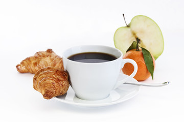 Cup of coffee with croissants and fruit