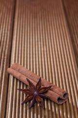 Cinnamon with anise on a wooden background