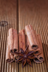 Cinnamon with anise on a wooden background