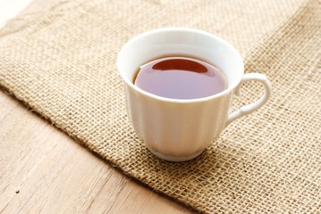 cup of tea over wooden background