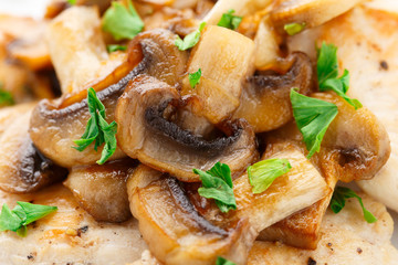 Fried chicken fillet with mushrooms