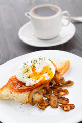Poached egg with mushrooms and tomatoes