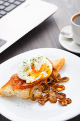 Poached egg with mushrooms and tomatoes