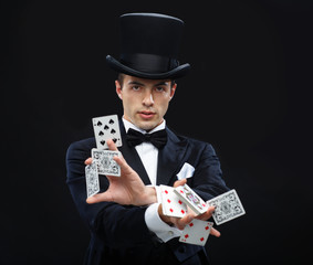 magician showing trick with playing cards