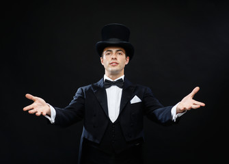 magician in top hat showing trick