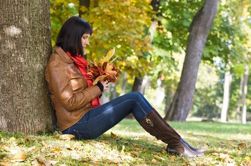 Woman sitting under the tree