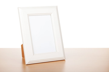 Photo frame on wood table