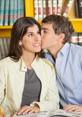 Man Kissing Girlfriend In College Library