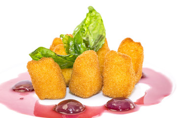 grilled cheese with berry sauce on a white background