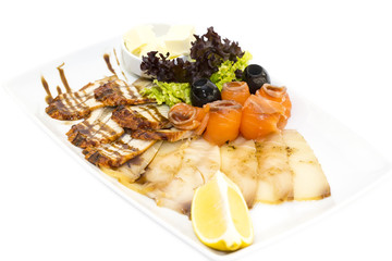 cutting of the fish on the table in a restaurant