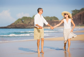 Happy senior couple on the beach. Retirement Luxury Tropical Res