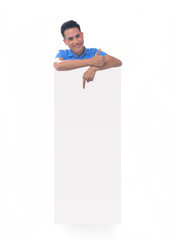 Young man holding blank billboard