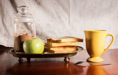 Bread and apple with drink,coffee,tea or cocoa
