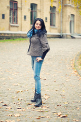 Young pretty woman standing on alley