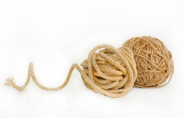 Two insulated coil twine on a white background.