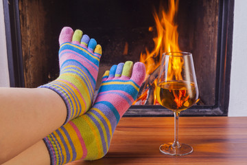  relaxing at fireplace in colorful funny toesocks