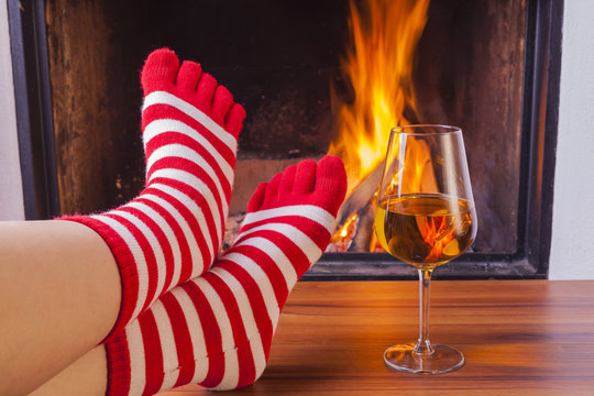  relaxing at fireplace in colorful funny toesocks