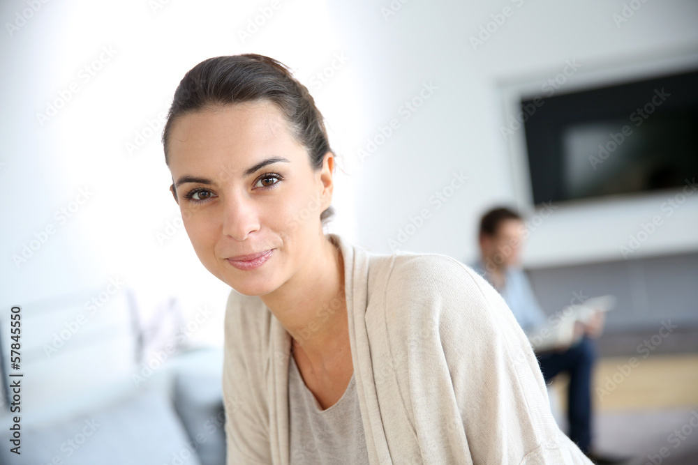 Wall mural gorgeous woman at home relaxing in living-room