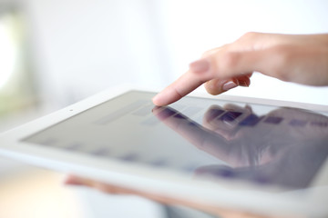Fototapeta Closeup of hand sliding on digital tablet obraz