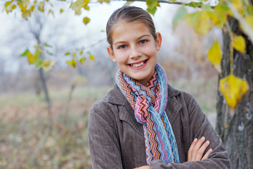 Girl walking in a autumn park