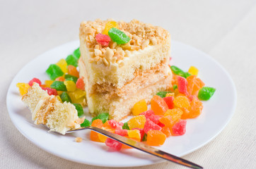 Delicious biscuit cake sprinkled with chopped nuts