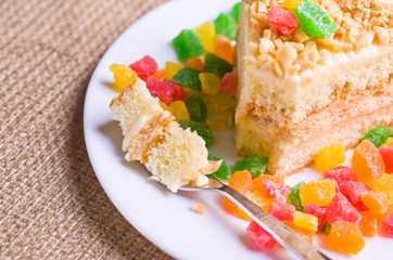 Delicious biscuit cake sprinkled with chopped nuts