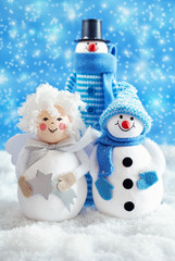 Christmas fun decorative figurines on a snowy background .