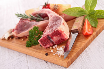 raw lamb chop on board.