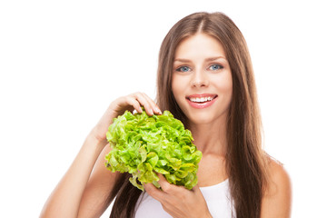 Young woman eating green salad